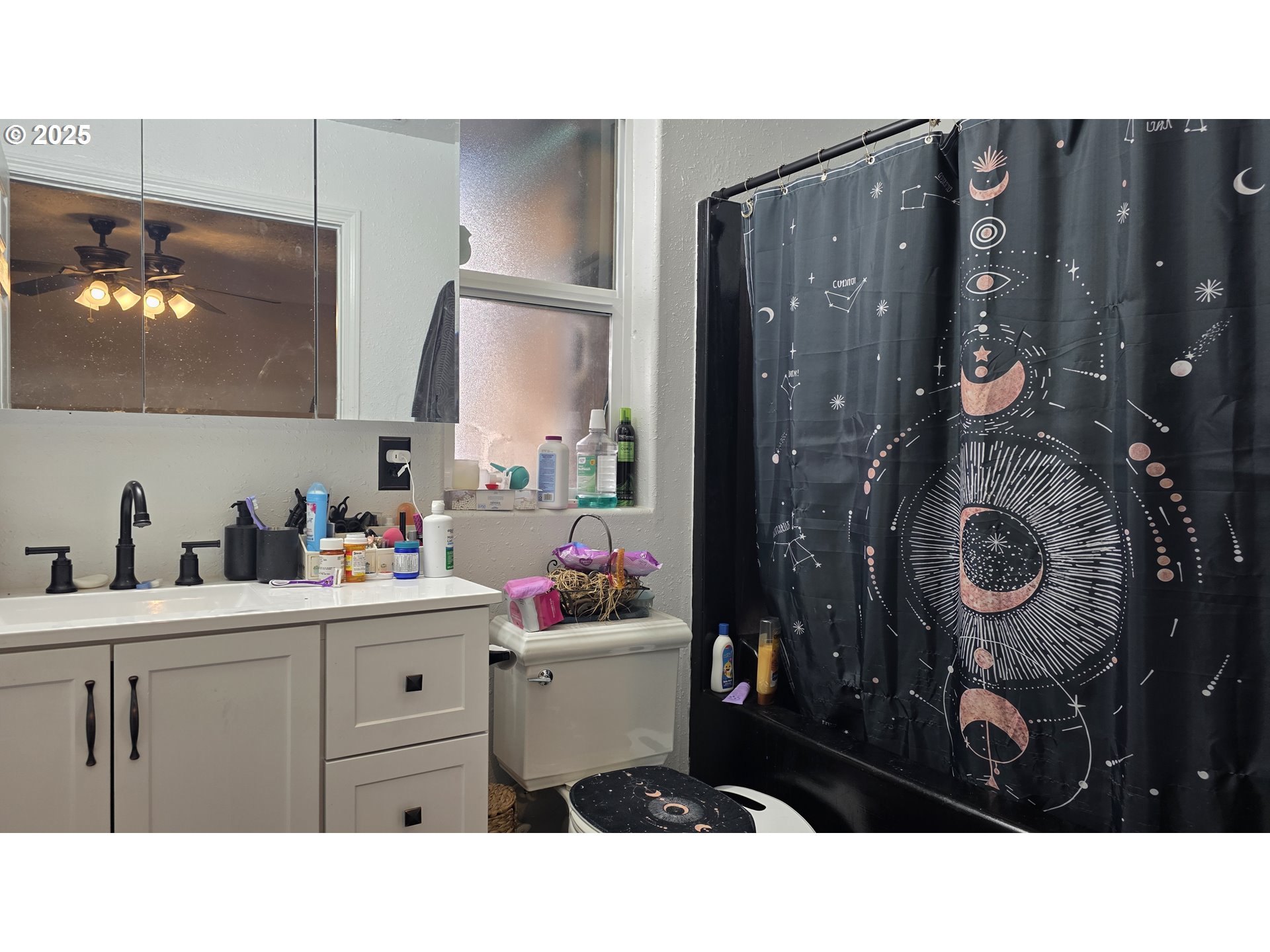 676 58th Street Springfield, OR 97478 - Photo 16 of 30 a bathroom with a sink vanity and mirror