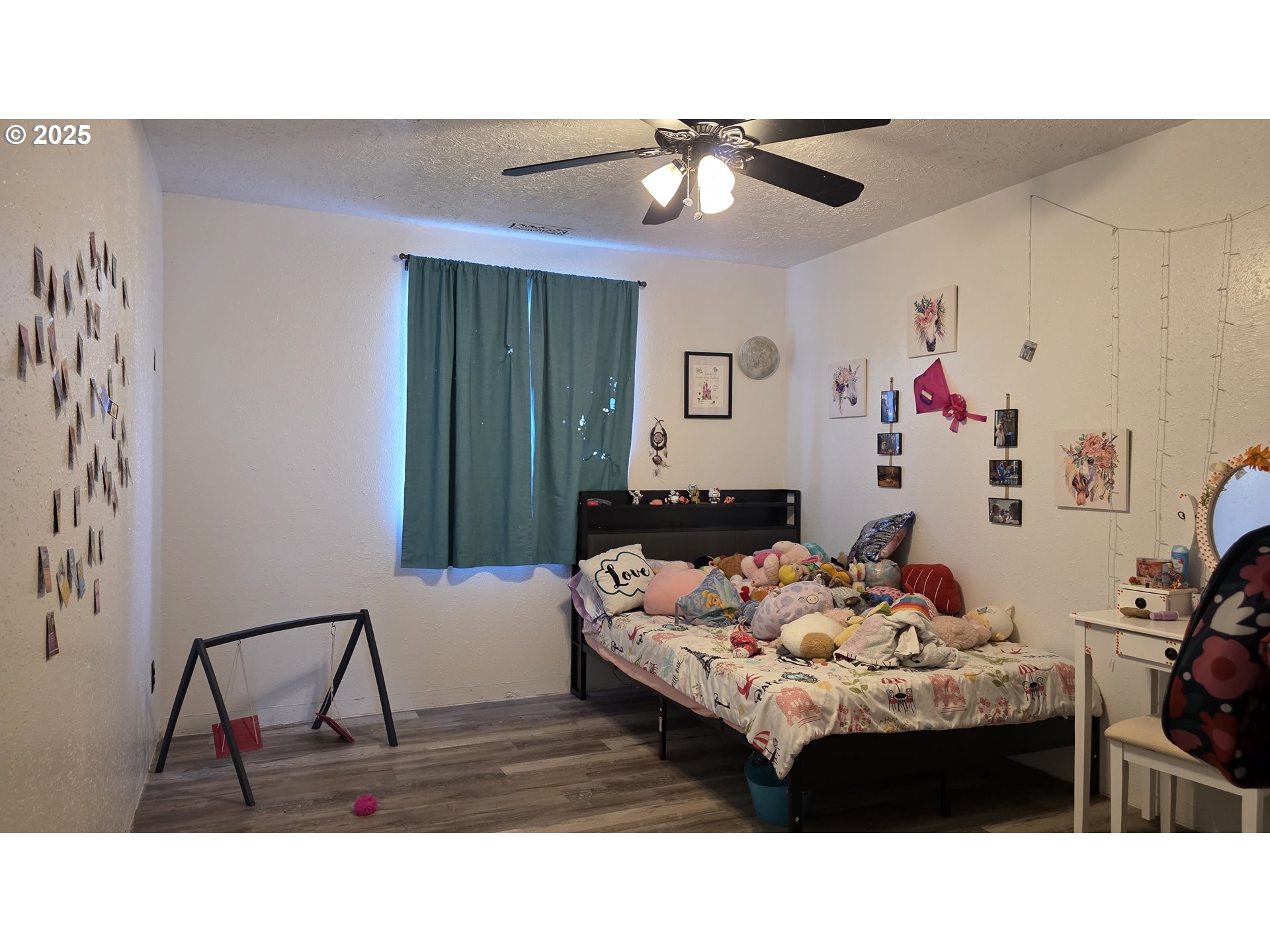 676 58th Street Springfield, OR 97478 - Photo 18 of 30 a bedroom with a bed and a chandelier