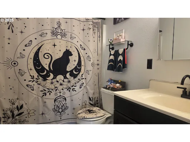 a bathroom with a sink and mirror