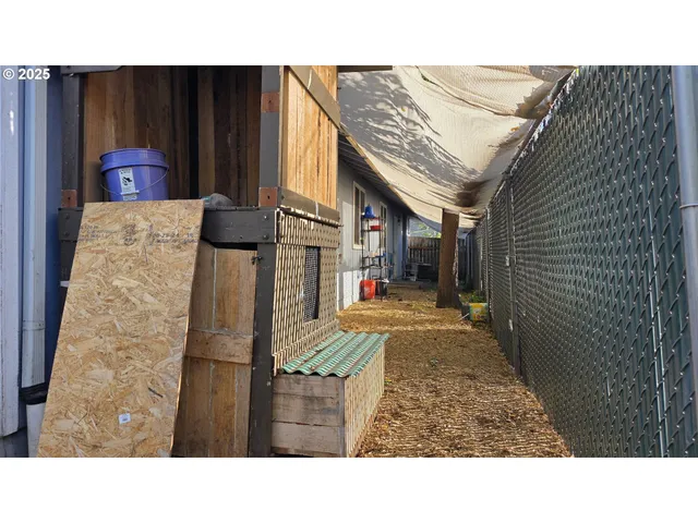 a balcony with furniture and a potted plant