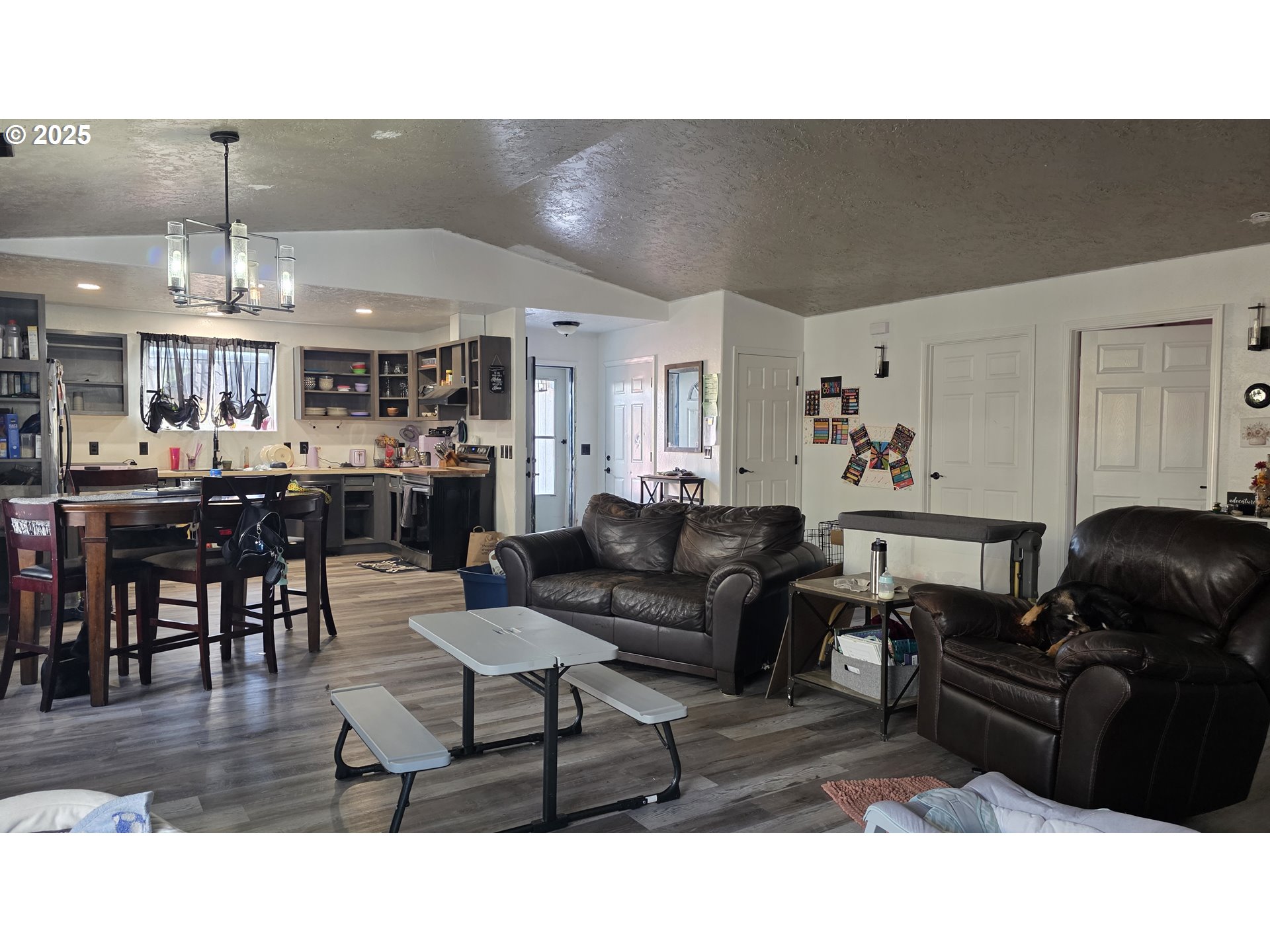 676 58th Street Springfield, OR 97478 - Photo 4 of 30 a living room with lots of furniture and kitchen view