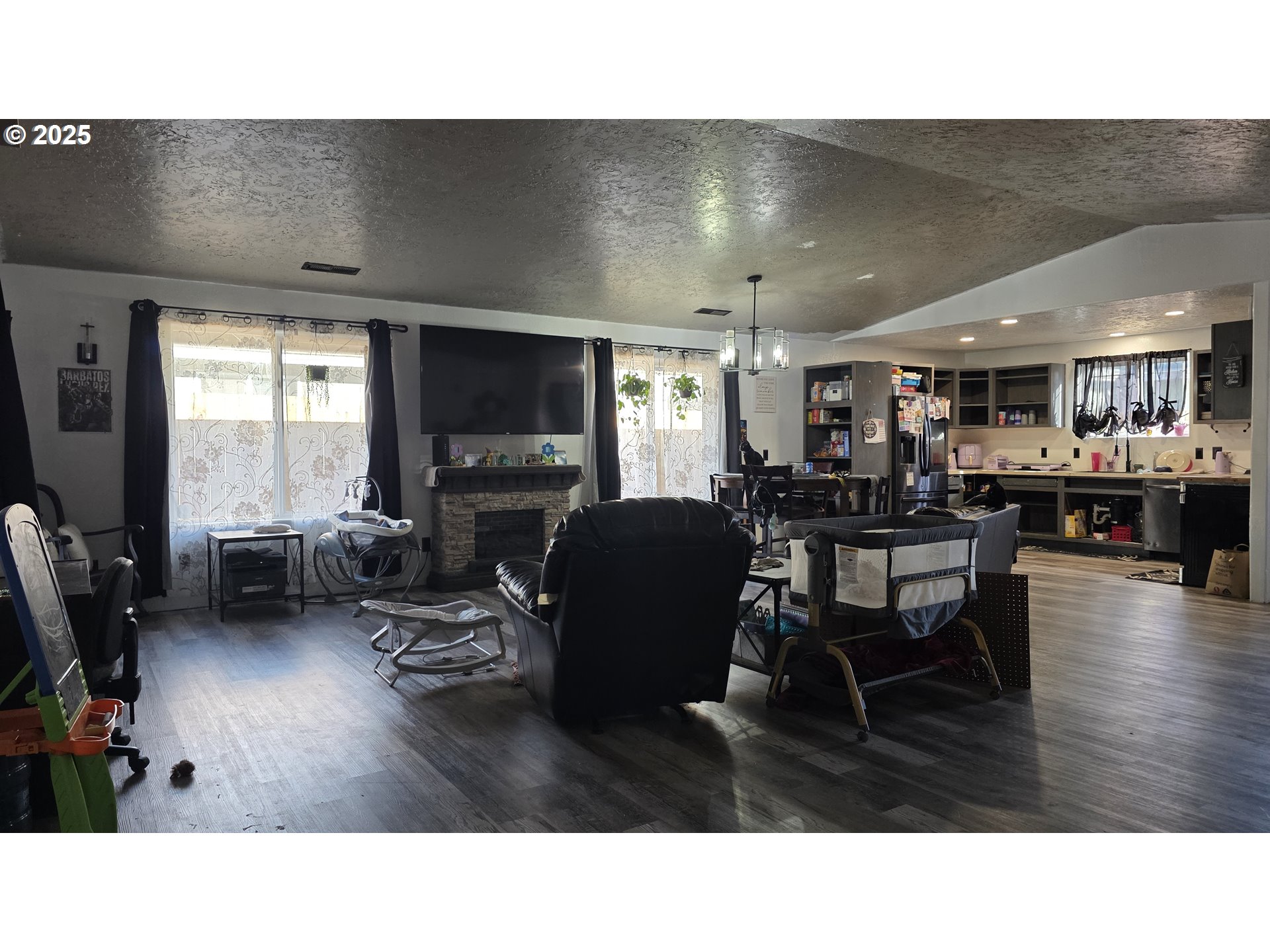 676 58th Street Springfield, OR 97478 - Photo 5 of 30 a living room with lots of furniture and kitchen view