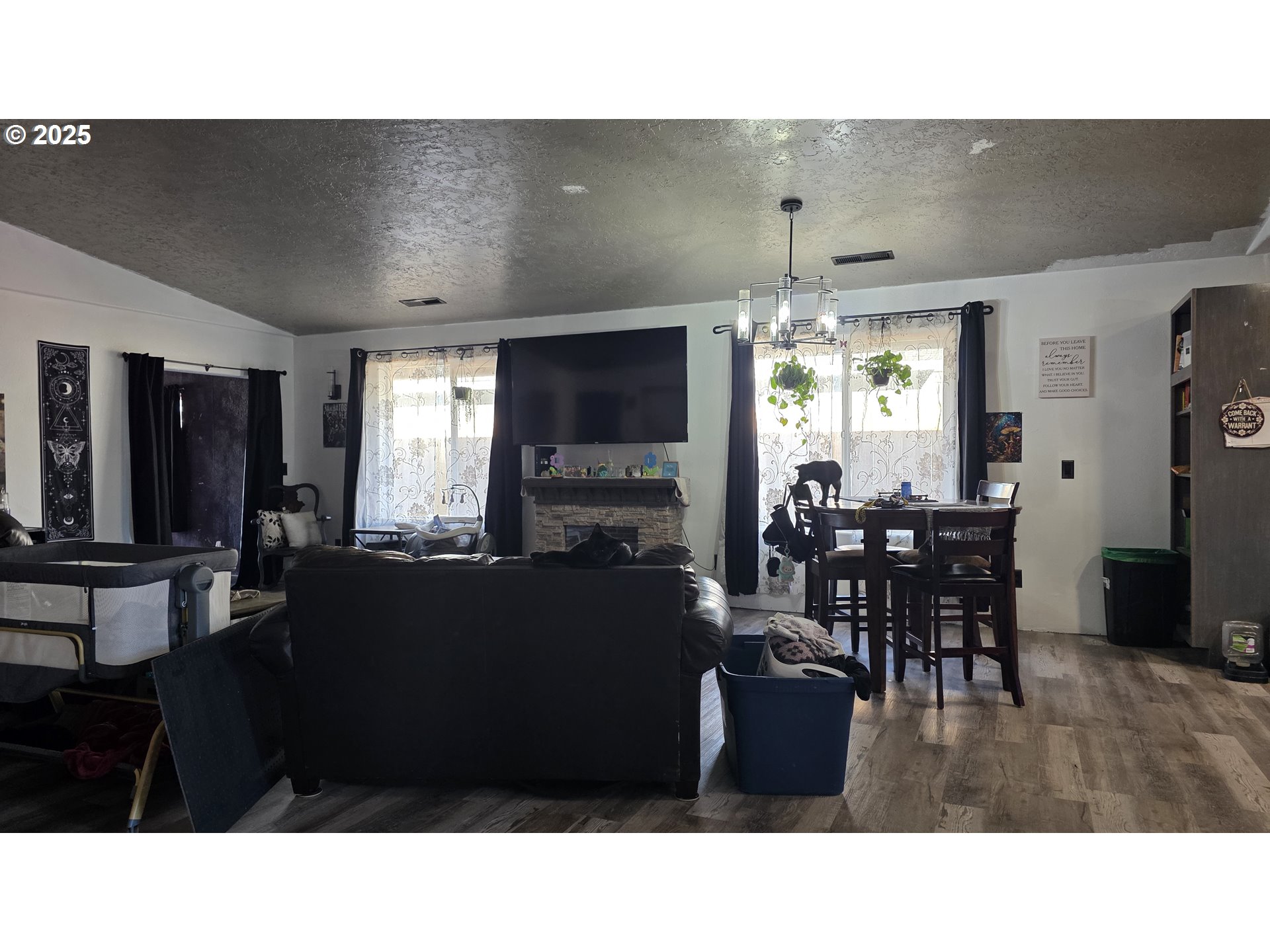 676 58th Street Springfield, OR 97478 - Photo 7 of 30 a living room with furniture a window and flat screen tv
