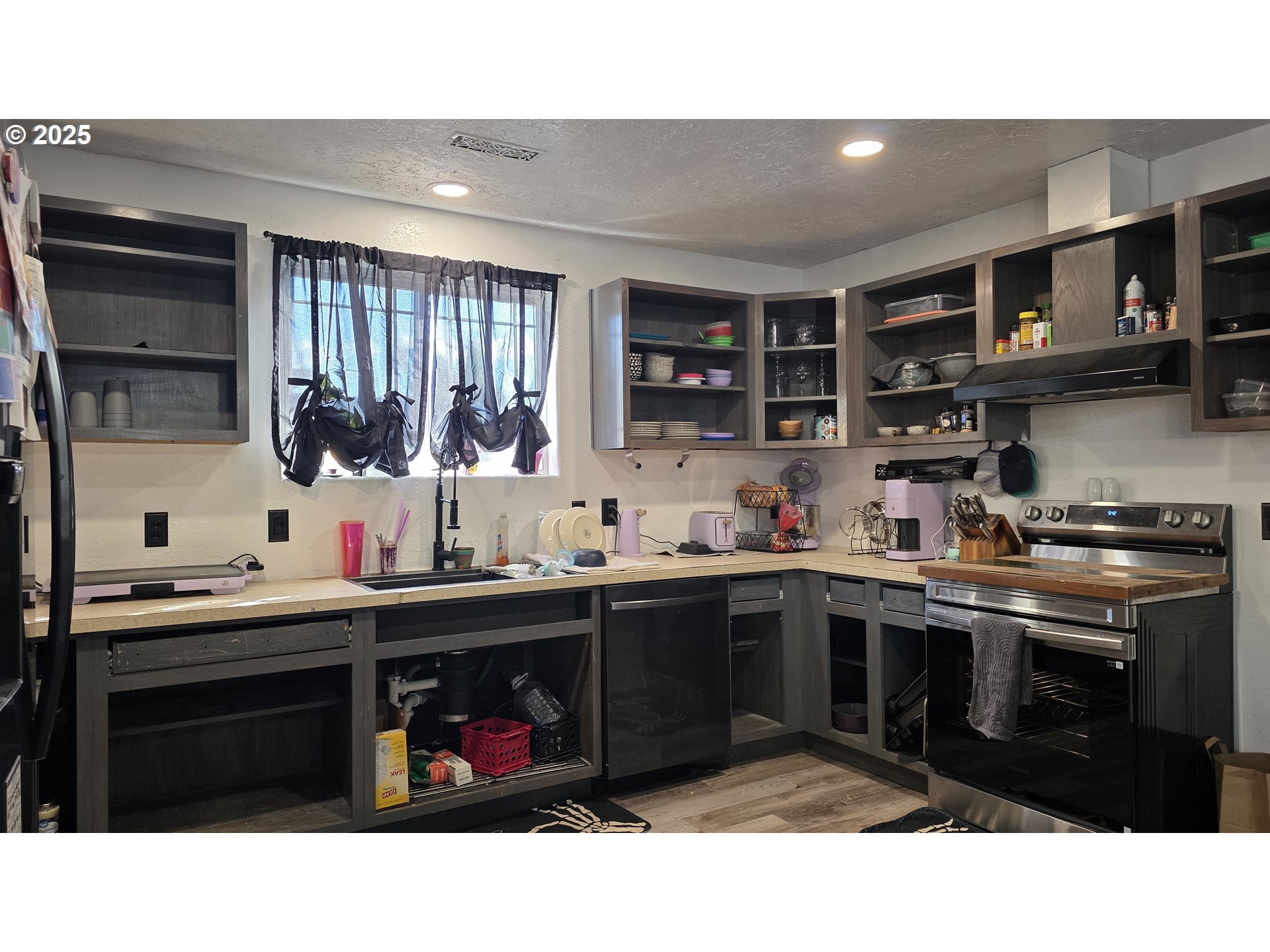 676 58th Street Springfield, OR 97478 - Photo 10 of 30 a kitchen with a sink and cabinets