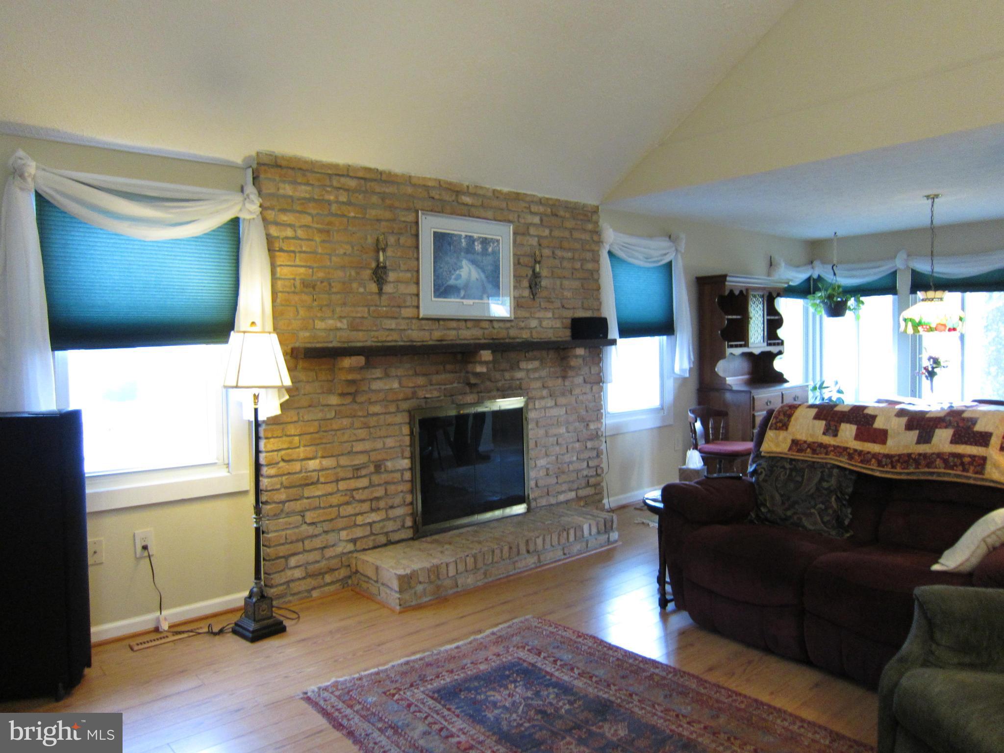 508 Riverside Drive Pasadena, MD 21122 - Photo 16 of 30 Family Room with vaulted ceiling and fireplace