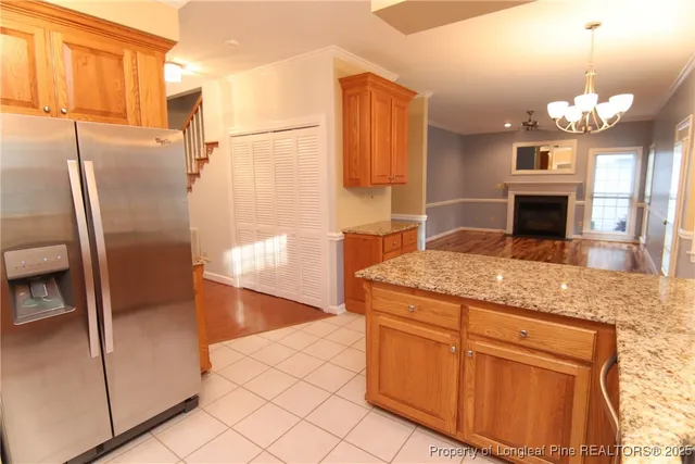 a kitchen with stainless steel appliances a stove sink and microwave