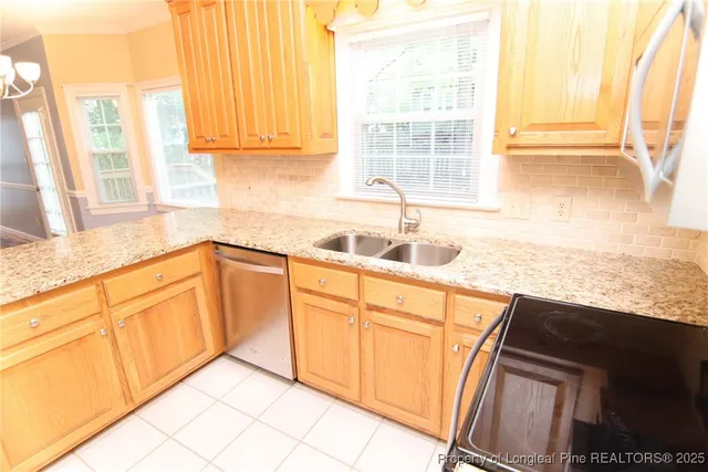 a view of a living room with hardwood floor and a ceiling fan