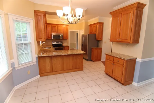 a view of empty room with wooden floor and fireplace