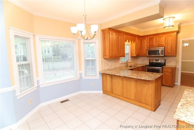wooden floor fireplace and windows in an empty room