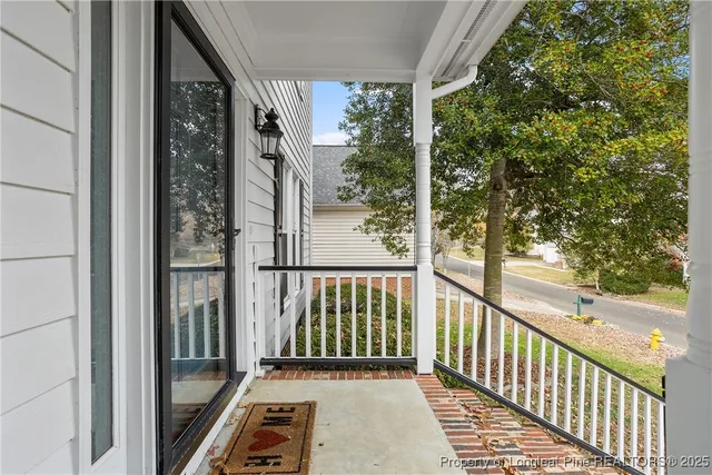 a view of a balcony with wooden floor