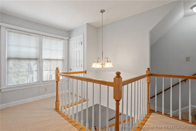 a view of a hallway with windows