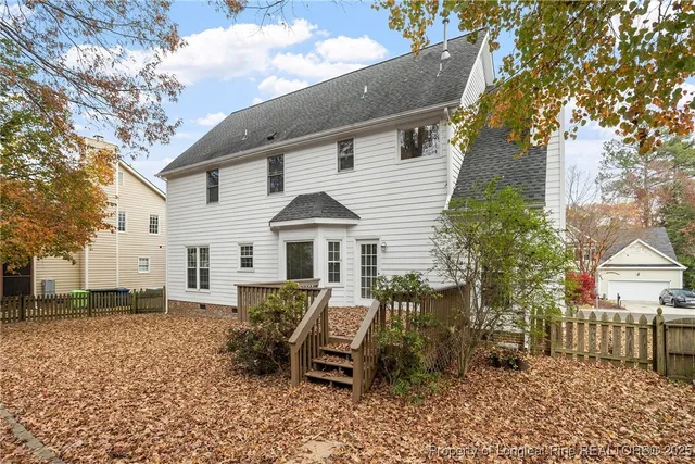 a view of a house with a yard chairs and table chair