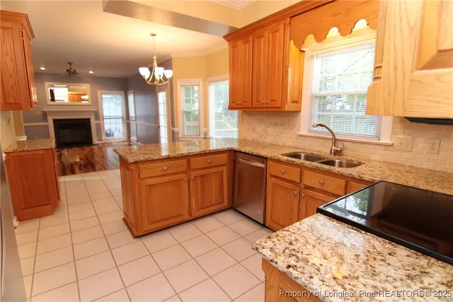 a kitchen with cabinets and stainless steel appliances