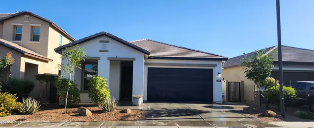 a front view of house with a yard