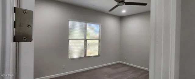 an entryway in a hall with wooden floor