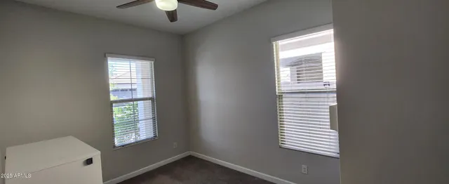 a view of hallway with stairs and wooden floor