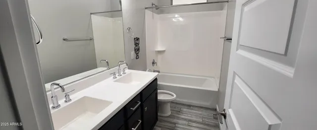 a view of a walk in closet and closet