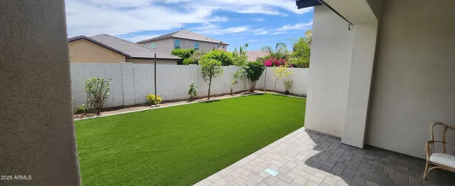 a view of a backyard with potted plants