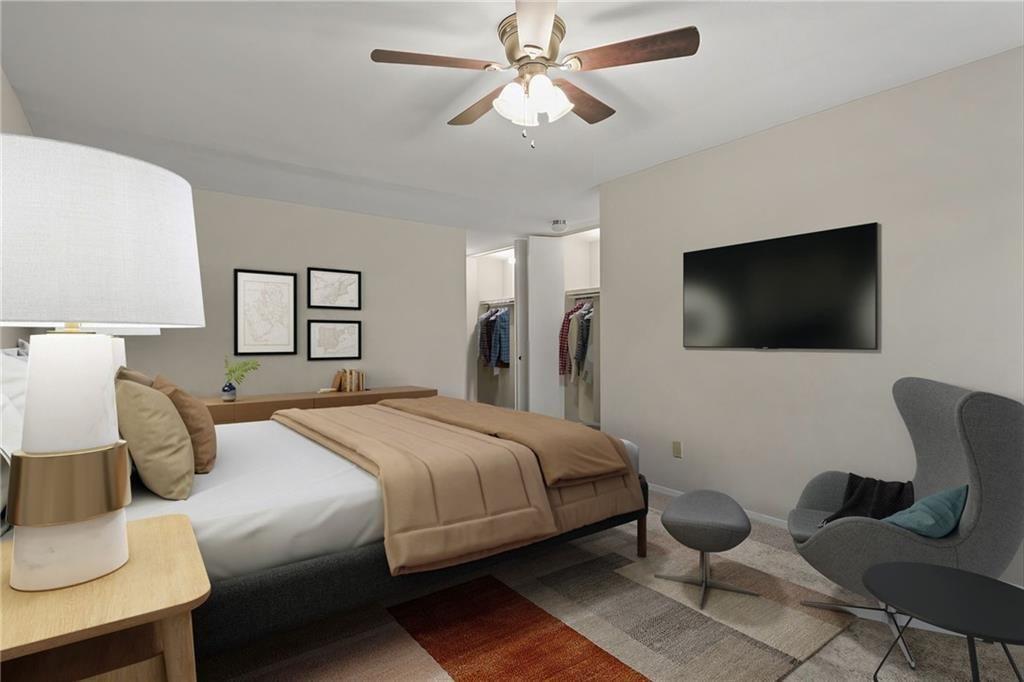 705 Edgewater Trail Sandy Springs, GA 30328 - Photo 14 of 36 a bedroom with a bed and a flat screen tv
