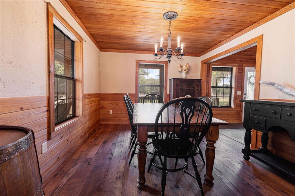 8091 County Road 476B Bushnell, FL 33513 - Photo 19 of 67 a view of a dining room with furniture window and wooden floor