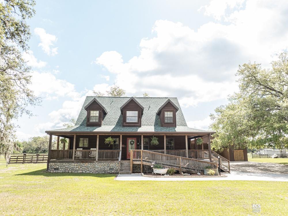 8091 County Road 476B Bushnell, FL 33513 - Photo 2 of 67 a front view of a house with swimming pool