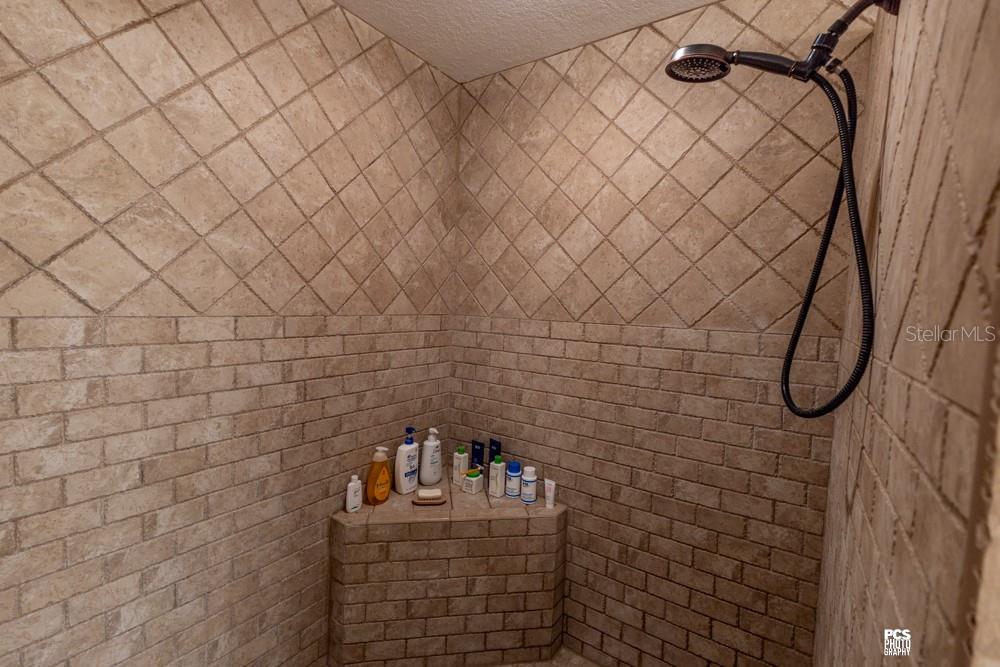 8091 County Road 476B Bushnell, FL 33513 - Photo 27 of 67 a bathroom with a shower