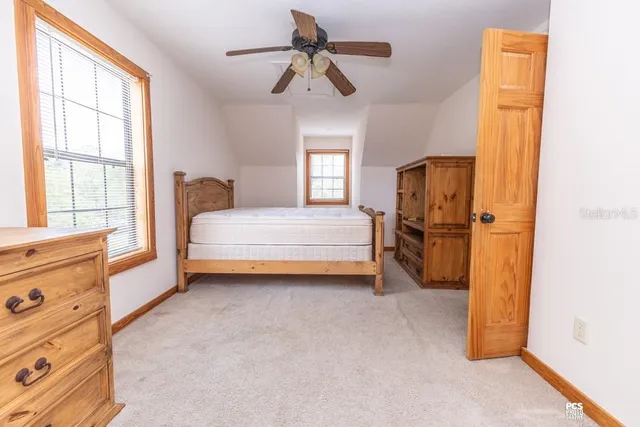 a view of entryway with wooden floor and stairs