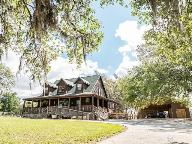 a outdoor space with patio fireplace and furniture