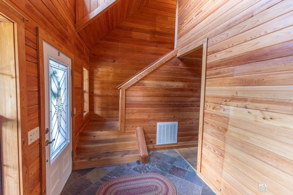 8091 County Road 476B Bushnell, FL 33513 - Photo 41 of 67 a view of entryway with wooden floor and stairs