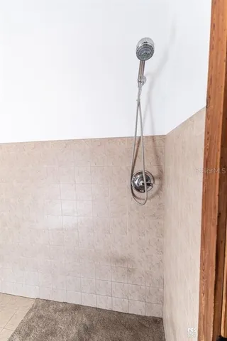 a front view of a house with swimming pool and sitting area