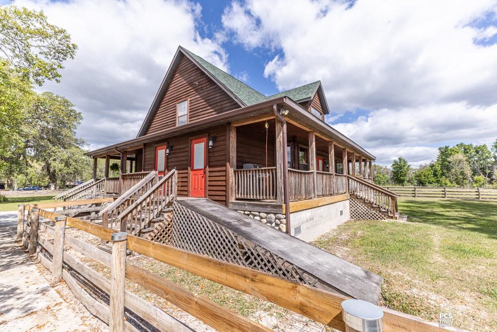 8091 County Road 476B Bushnell, FL 33513 - Photo 49 of 67 a view of a house with a roof deck