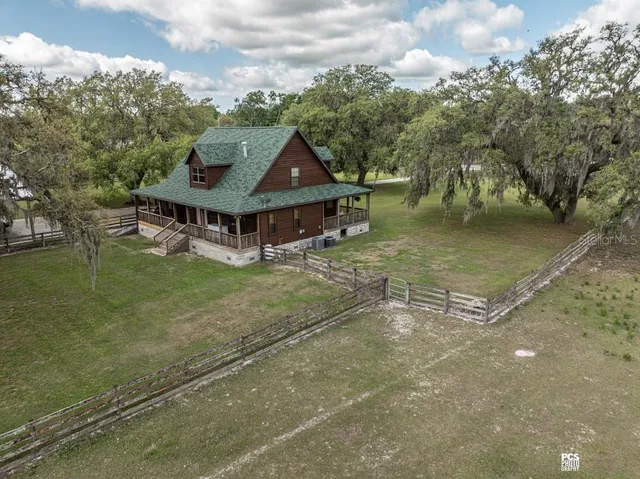 a view of a chairs and table on the wooden floor