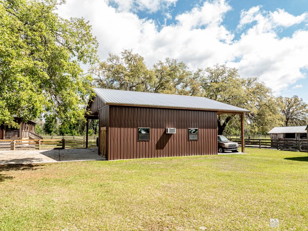 8091 County Road 476B Bushnell, FL 33513 - Photo 53 of 67 a front view of a house with a yard and sitting area