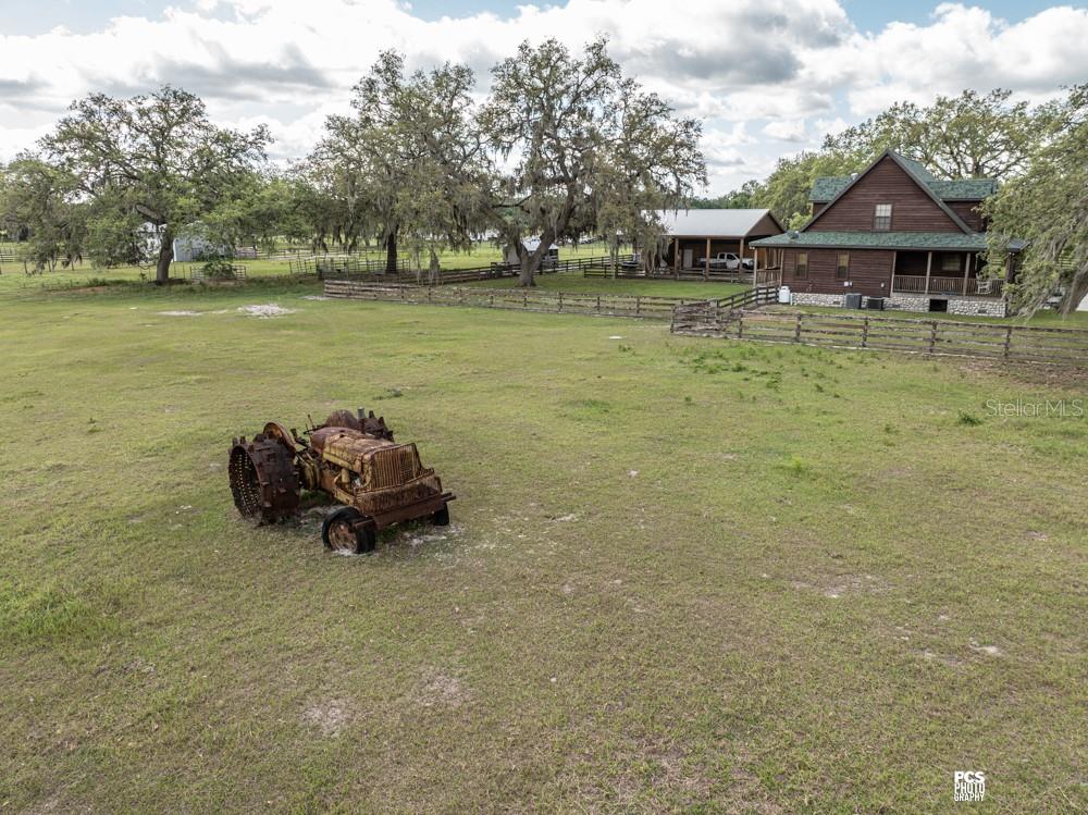 8091 County Road 476B Bushnell, FL 33513 - Photo 61 of 67 a blue swimming pool is sitting in the water next to a yard