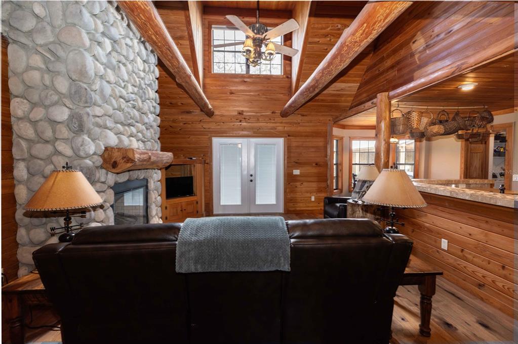 8091 County Road 476B Bushnell, FL 33513 - Photo 9 of 67 a living room with furniture and a chandelier