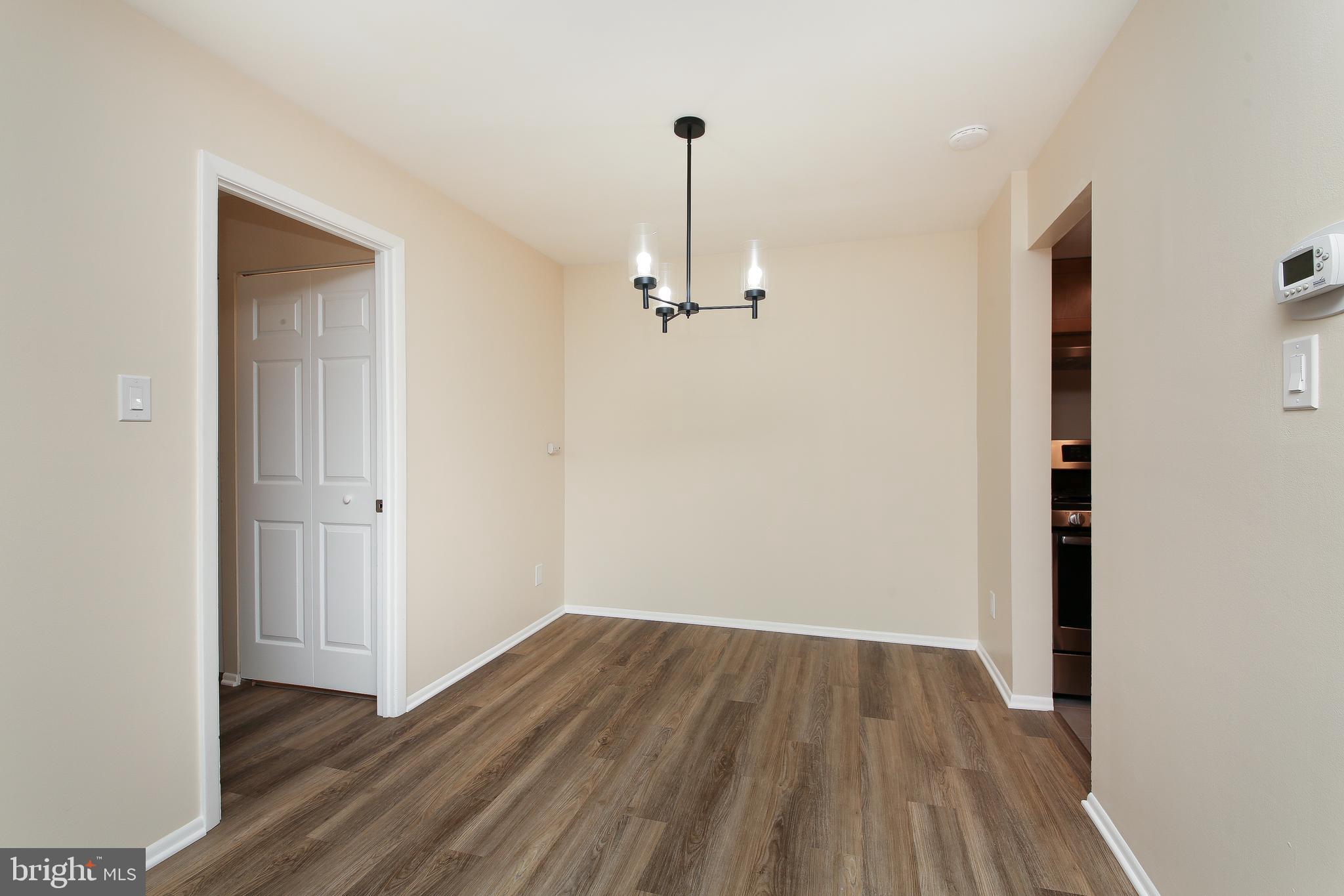 463 Old Forge Crossing, Unit 463 Devon, PA 19333 - Photo 6 of 35 Rustic lighting fixture in the dining area