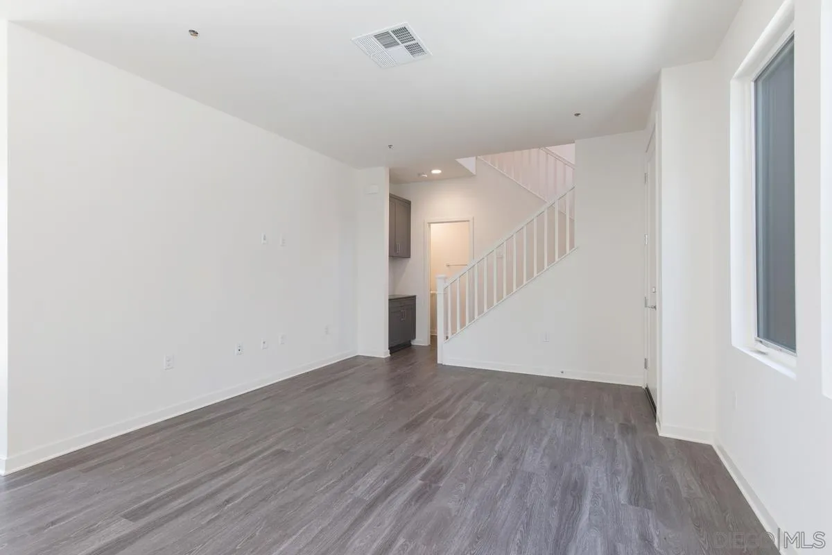 4049 Mission Inn Avenue Riverside, CA 92501 - Photo 17 of 53 a view of a hallway with wooden floor