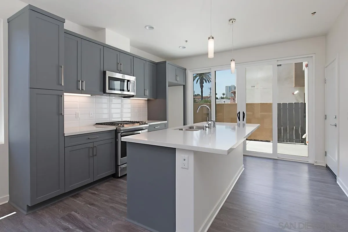 4049 Mission Inn Avenue Riverside, CA 92501 - Photo 23 of 53 a kitchen with stainless steel appliances granite countertop a sink stove and refrigerator