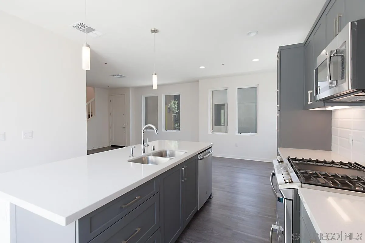 4049 Mission Inn Avenue Riverside, CA 92501 - Photo 26 of 53 a kitchen with a sink and a stove top oven