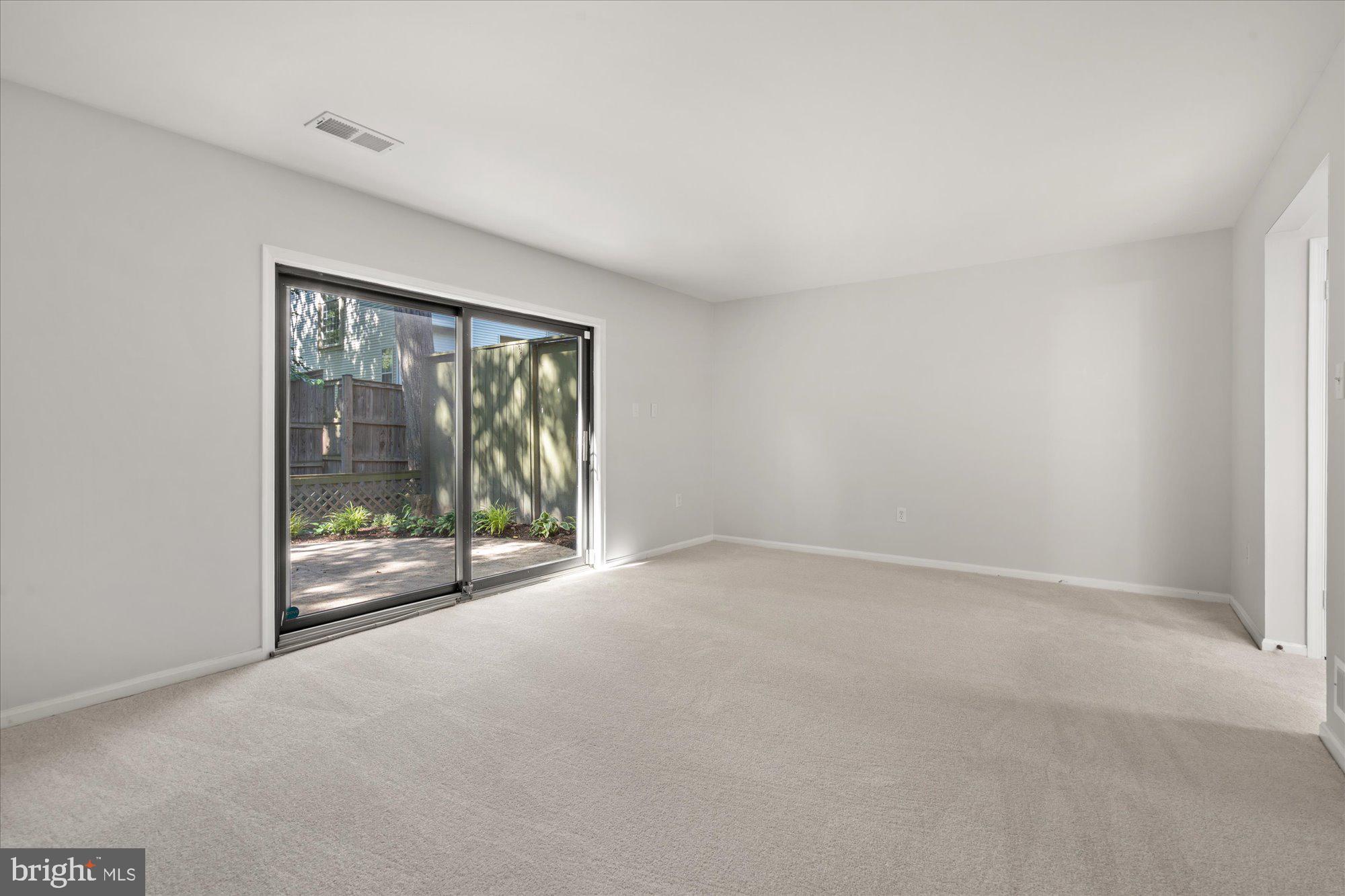2116 Bucknell Terrace, Unit 35 Silver Spring, MD 20902 - Photo 18 of 26 Walkout basement with a sliding glass door