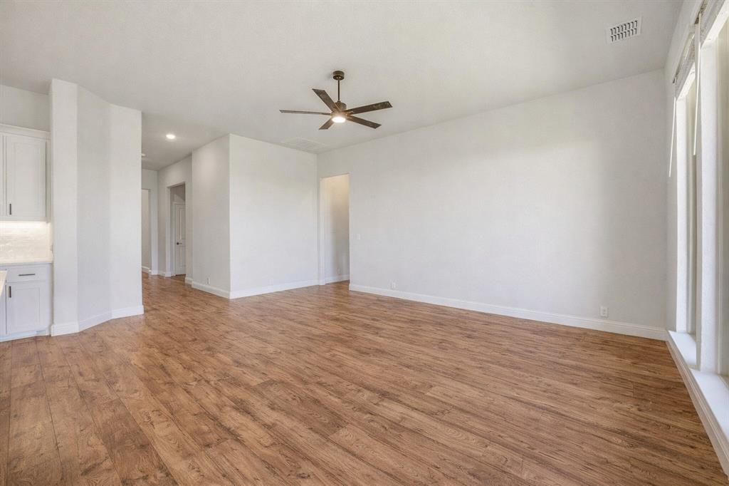 800 Jaguar Ridge Godley, TX 76044 - Photo 4 of 23 a view of empty room with wooden floor