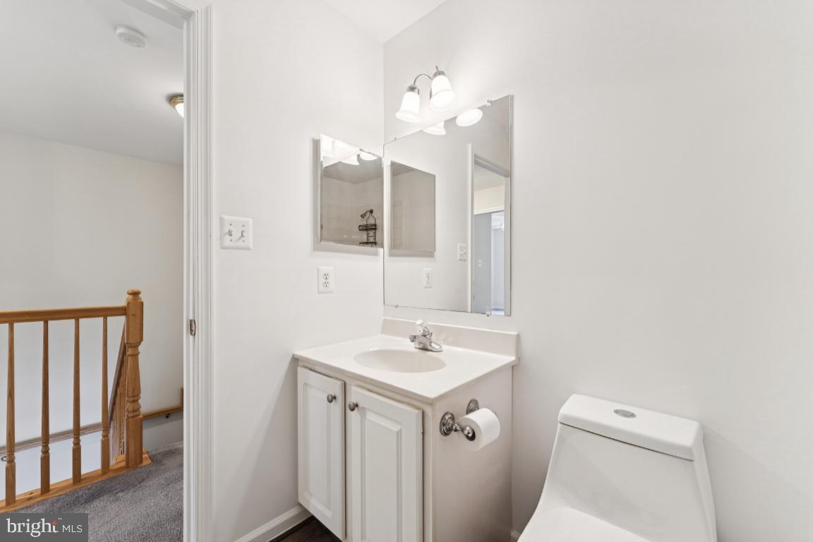 13 Ohara Court Olney, MD 20832 - Photo 21 of 25 a bathroom with a sink vanity and a mirror