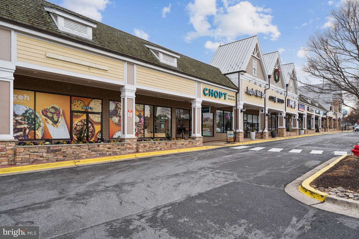 13 Ohara Court Olney, MD 20832 - Photo 25 of 25 a view of a building with floor to ceiling windows and a ceiling fan