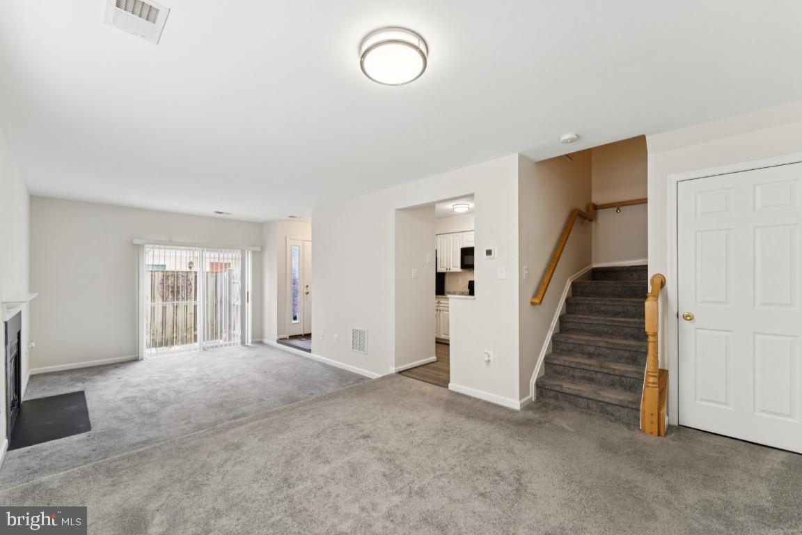 13 Ohara Court Olney, MD 20832 - Photo 7 of 25 a view of a livingroom with wooden floor and stairs