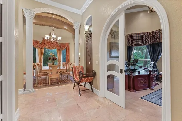a spacious bedroom with a bed and wooden floor