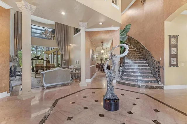 a kitchen with stainless steel appliances kitchen island granite countertop a stove a sink and a refrigerator