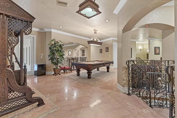 a living room with furniture a fireplace and a large mirror