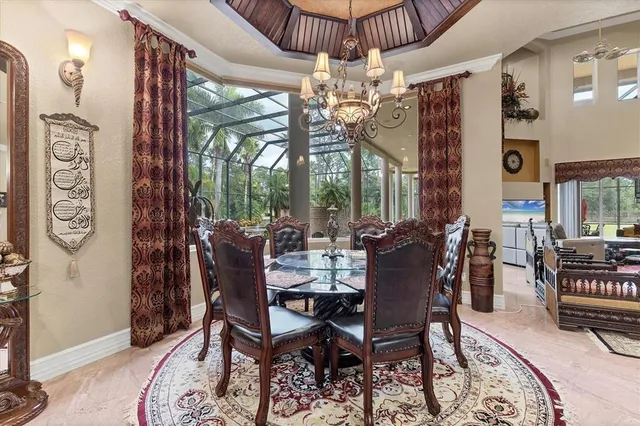 a living room with furniture a table and a potted plant