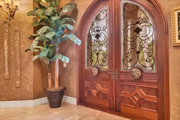 a living room with furniture a dining table and a chandelier