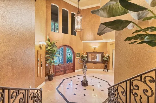 a view of a livingroom with furniture and a ceiling fan